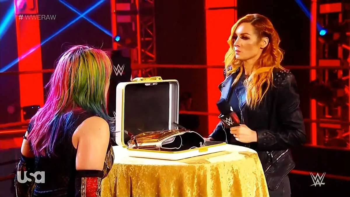 Becky Lynch hands title to Asuka